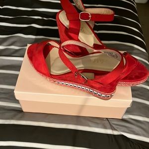 Red wedge platform sandals with silver design, size 9. Bella Marie collection.